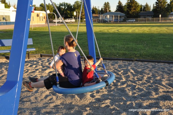 Family fun on the saucer swing