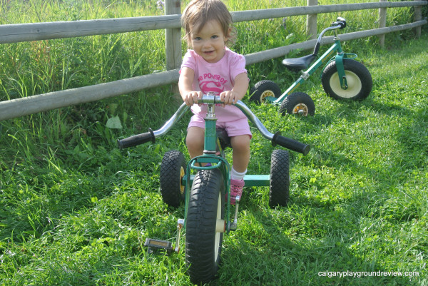 Girls on a green trike