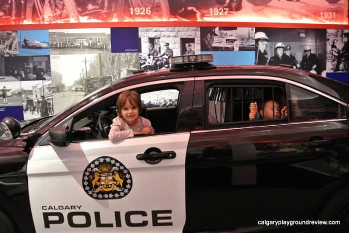 Kids in a police car photo op - Calgary Youthlink Police Interpretive Centre