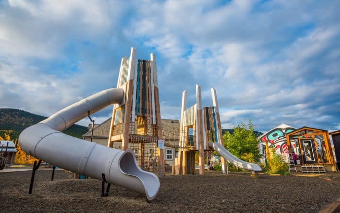 Featured Playgrounds Carcross Commons - Carcross, Yukon This beautiful and unique playground was was inspired by local history, Yukon landmarks, and First Nations creation stories. (photo courtesy of Earthscape) Terra Nova Natural Play Environment - Richmond, BC More than just a playground, this destination park strives to make city kids feel more connected to nature through the use of natural play materials, lots of space, trees, and other vegetation. (photo courtesy of Calgary Playground Review ) Broadmoor Lake Park - Sherwood Park, AB This eye-catching playground beside Broadmoor Lake, near Edmonton, has something for everyone, including a huge slide, a climber shaped like a ship, a natural play area, and a ship-themed spray park. (photo courtesy of Calgary Playground Review) Potash Corp Playland Kinsmen Park - Saskatoon, Saskatchewan Located next to a mini fair, this playground features natural climbing features and a zipline, as well as a sand play area and interactive water play area. (photo courtesy of Saskatoon Playground Review) Nature Playground in Assiniboine Park - Winnipeg, Manitoba This creative, sprawling, natural play area is designed to spark children’s imagination through active play and includes both a sand play area and an interactive water play area. (photo courtesy of Assiniboine Park Conservancy) Mooney Bay’s - Ottawa, ON Billed as Canada's largest playground, Mooney's Bay Park was featured on the program Giver and was designed to celebrate Canada's 150th birthday with areas of the playground showcasing each of Canada’s 10 provinces and 3 territories. (photo courtesy of Stroller Parking) Baie de Beauport - Quebec City, QC Located right along the river, this playground featuring Kompan equipment offers great views and lots of exciting climbing opportunities, as well as a nearby splashpad. (photo courtesy of Atmosphäre Inc) Highland Park - Salisbury - New Brunswick Salisbury’s Highland Park is a perfect all-season park with a natural playground, walking trails by the Petitcodiac River, a brand-new splash pad, traditional playground equipment, and lots of green space to enjoy - just 7kms off the Trans Canada Highway outside Moncton. (photo courtesy of Pickle Planet Moncton) Dewolf Playground - Bedford, NS A perfect playground for the preschool set, with stunning views of the Halifax Harbour and bridges, this nautical themed playground offers accessible flooring, a large sunshade, and even a working periscope. (photo courtesy of Itsy Bitsy Haligonians) Bannerman Park - St. John’s, Newfoundland Newfoundland's first public park, located in downtown St. John's, is newly-renovated with a large accessible playground that will appeal to kids of all ages. The park also offers a loop skating rink in the winter and a spray park in the summer. (photo courtesy of Jennifer M. Stamp) Eliot River Dream Park - Cornwall, PEI This distinctive Leathers & Associates 10,000 square foot wooden, inclusive playground will make kids feel like they are exploring a castle. (photo courtesy of Leathers & Associates) Dufferin Grove - Toronto, ON One of the best adventure playgrounds in Canada, in addition to a variety of traditional equipment, this shady playground features a huge sand pit with a working tap, right in the middle of Toronto. (photo courtesy of Multiple Momstrocity) Nathan Shuster Park - Montreal, QC This park will test your balance and bravery! A rope, log, and, boulder obstacle course circles part of the playground, while a zipline will fling you towards the finish line. (photo courtesy of Stroller Parking) Currie Barracks Airport Playground - Calgary, AB Your kids’ imagination will soar as they go down the tall control tower slide at this airport-themed playground. (photo courtesy of photo courtesy of Calgary Playground Review ) Riverside Park - Kamloops, BC Located near downtown right along the river, this accessible playground boasts a huge web climber, a nearby water park, and music in the park on summer nights. (photo courtesy of Kamloops Playgrounds) Springbank Park - London, ON You could spend all day at this huge London park which features a colourful accessible playground, sandbox area, and wading pool. (photo courtesy of London Playground Review) Baycliffe Park - Whitby, ON Your kids will love racing down the two story tunnel slides at this rocket-themed playground. The park also features a nearby splash pad and BMX pathway. (Photo courtesy of Durham Region Playground Reviews) Sandra Schmirler Play Space - Regina, SK With a large castle-themed playground, toddler-sized treehouse climber, and a wonderful nearby spray pad, kids will sure to be impressed with this Regina playground. (photo courtesy of Kinderbuzz) Marnevic Memorial Park - Fox Creek, AB This playground’s heavy duty construction equipment theme can be seen throughout, from the large pieces all the way down to the activity panels. (photo courtesy of Calgary Playground Review) Exhibition Park Playground - Guelph, ON This natural playground uses wood extensively to create a huge variety of challenging playground features, in addition to a sand play area and water pump. (photo courtesy of Earthscape) Queenston Park - Coquitlam, BC This eye-catching playground is set into a hill providing a very unique play experience. (photo credit: Landscape Structures) Variety Heritage Adventure Park at The Forks - Winnipeg, MB Located right outside The Forks National historic site, this playground provides a dramatic backdrop for kids to experience The Forks history through creative and imaginative play. (photo courtesy of Play by Crozier) Grange Park (AGO Playground) - Toronto, ON [ replace with actual photo] The play structures at this brand new imaginative playground, near the Art Gallery of Ontario, represent elements of an artist studio. (photo courtesy of Earthscape) Rotary Club’s Pirate Ship playground - Belleville, ON This huge wooden pirate ship themed playground provides a delightful backdrop for imaginative play. (need photo with permission) OR Swap out for Quinte West (Batawa Earthscape park) Cadboro-Gyro Park - Victoria, BC Watch out for sea monsters at this popular waterfront playground. The playground has been recently revitalized but you can still find the iconic sea creatures. (photo courtesy of Saanich Parks)