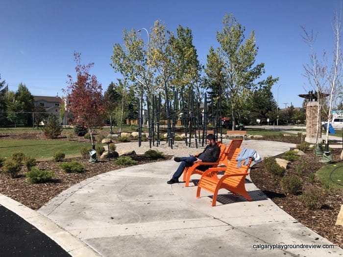 Adirondack Chairs and stick forest at Harvest Park in Harvest Hills