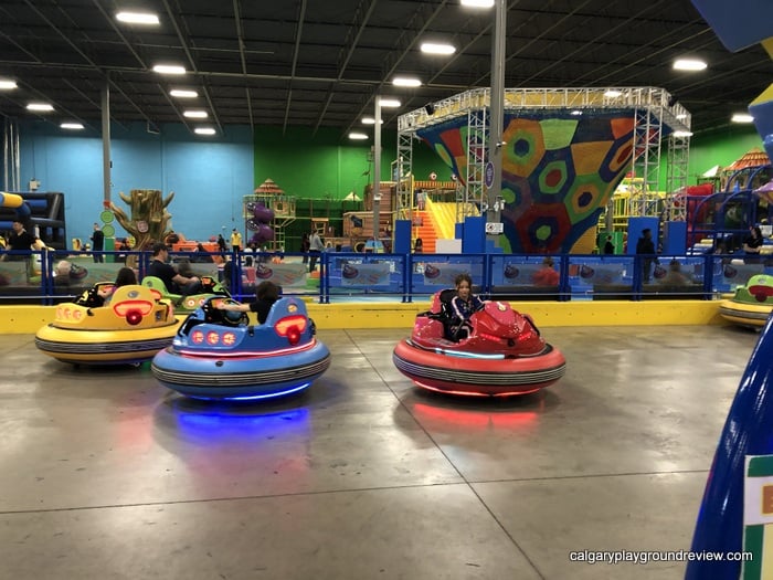 Kids in the Happy Bumper Cars at the Big Box with the Leisure Lagoon in the background