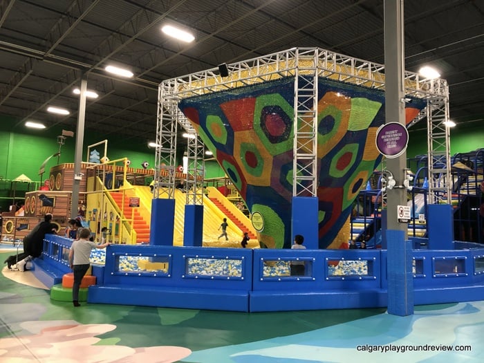 Net climber with wide slide and ball pit