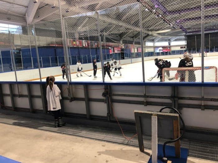 Olympic Oval arena with UofC Dinos and PWHPA players on the ice 