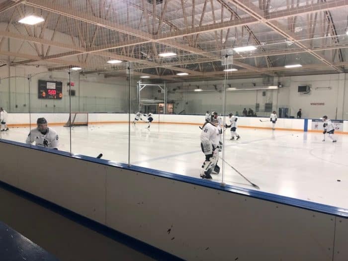 View of the ice and scoreboard at Rose Kohn Arena - PWHPA Players on the ice